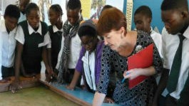 Anna Tolan with a group of school children