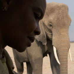 Katito Sayialel in front of an elephant