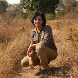 A portrait of Poonam Dhanwatey in the field