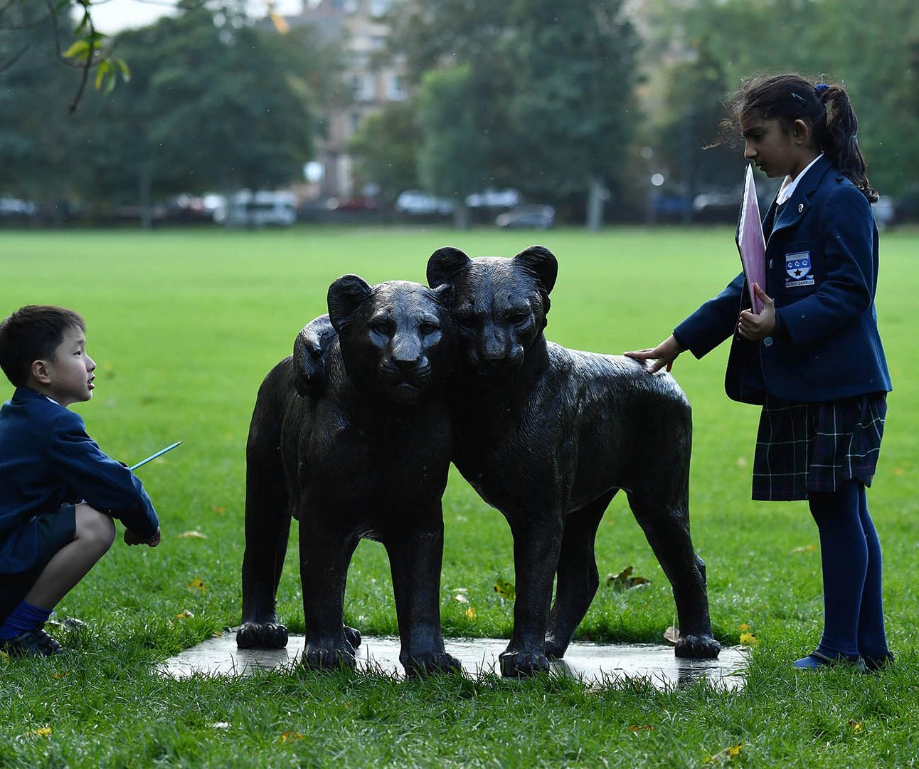 Students from George Heriot’s School at ‘Born Free Forever’, an exhibition opening today at The Meadows in Edinburgh by international wildlife charity, Born Free, aiming to raise awareness of threats facing the lion population. Mark Runnacles/PA Wire.