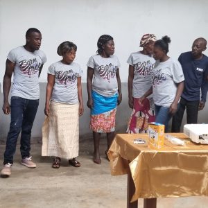 A group of men and women in grey Born Free t-shirts