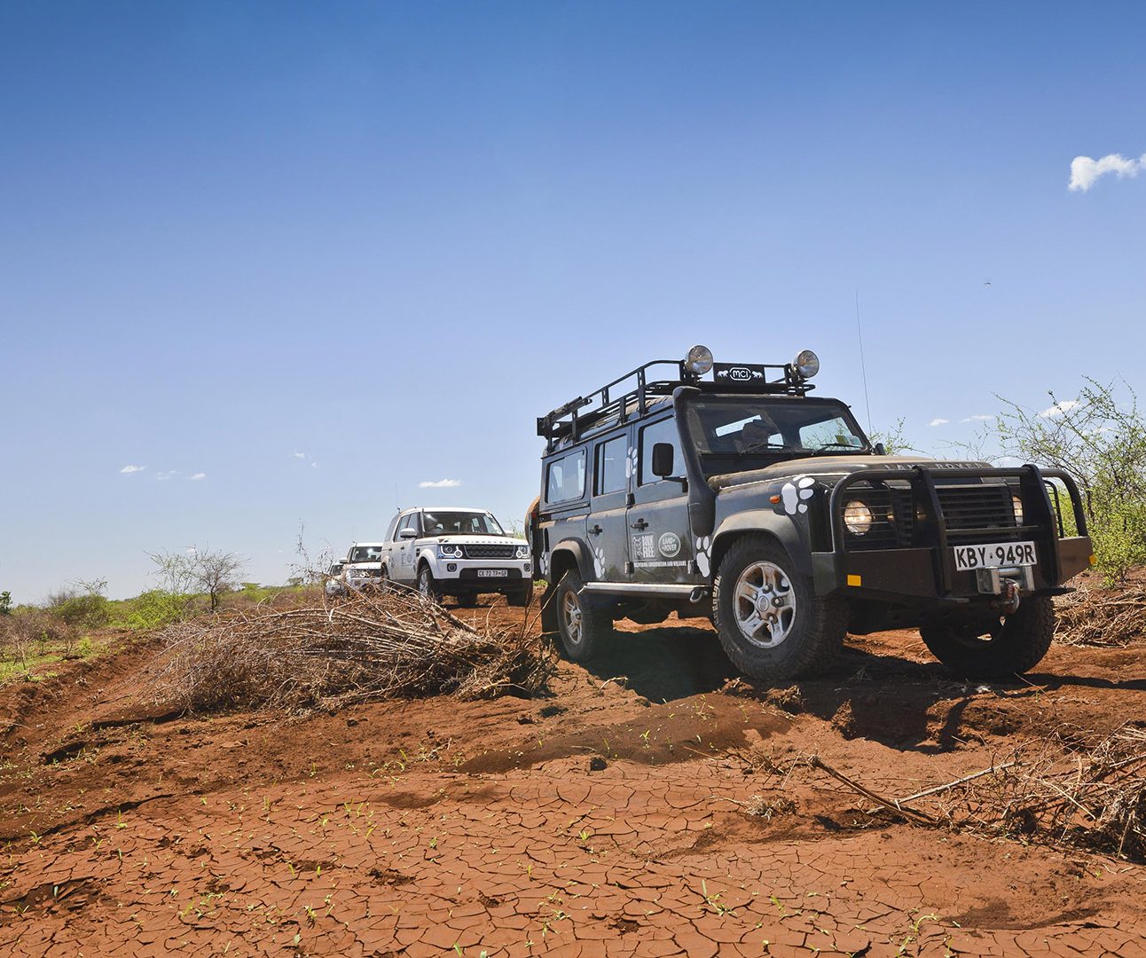 A Born Free vehicle driving through dusty landscape