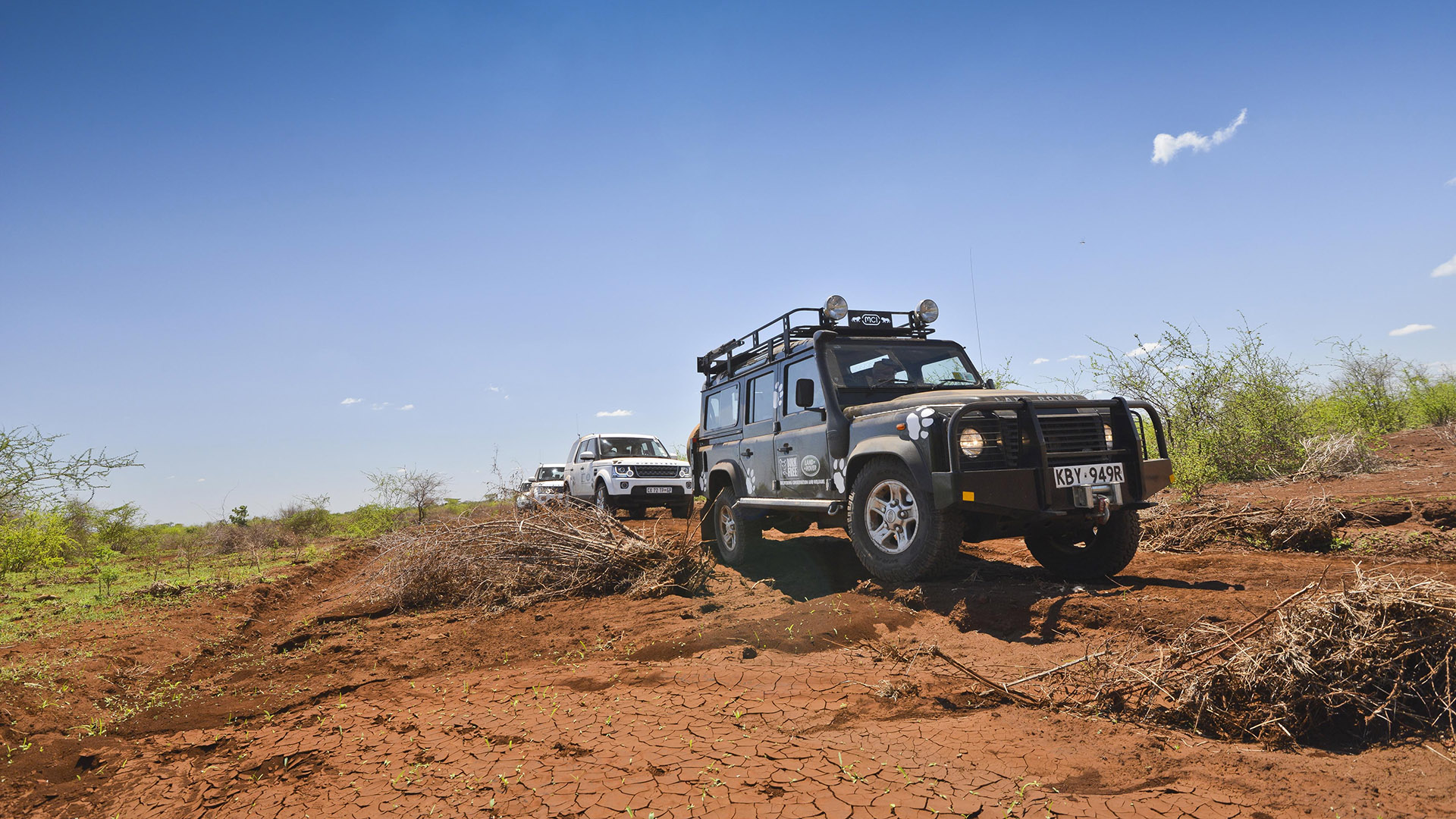 A Born Free vehicle driving through dusty landscape