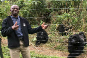 Jackson Mbeke stood in front of a fence