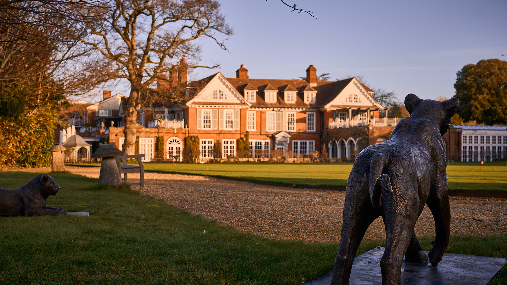 A bronze lion statue in front of Chewton Glen hotel