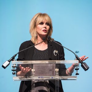 Joanna Lumley standing at a podium