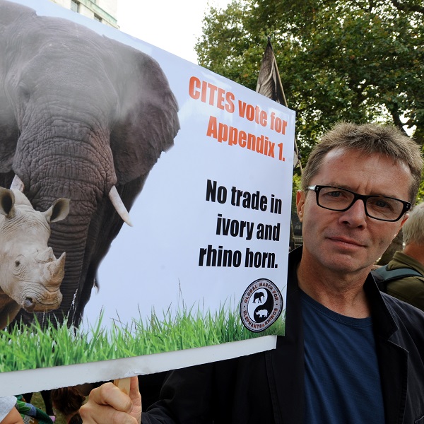 Nicky Campbell with an elephant placard