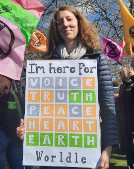 Dr Nikki Tagg holding a placard at the rally