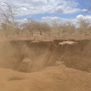 Deep gully cut into the road by soil erosion to the south of Amboseli National Park