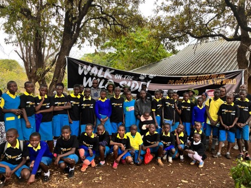 A large group of Kenyan school children wearing Born Free t-shirts