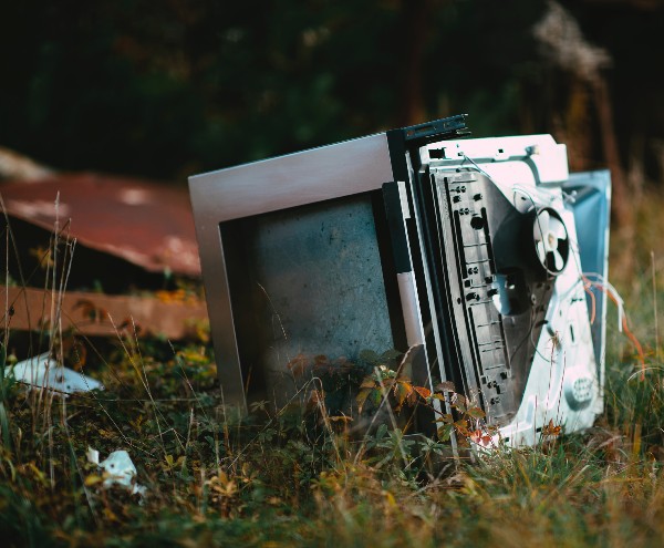 A dumped computer in a field