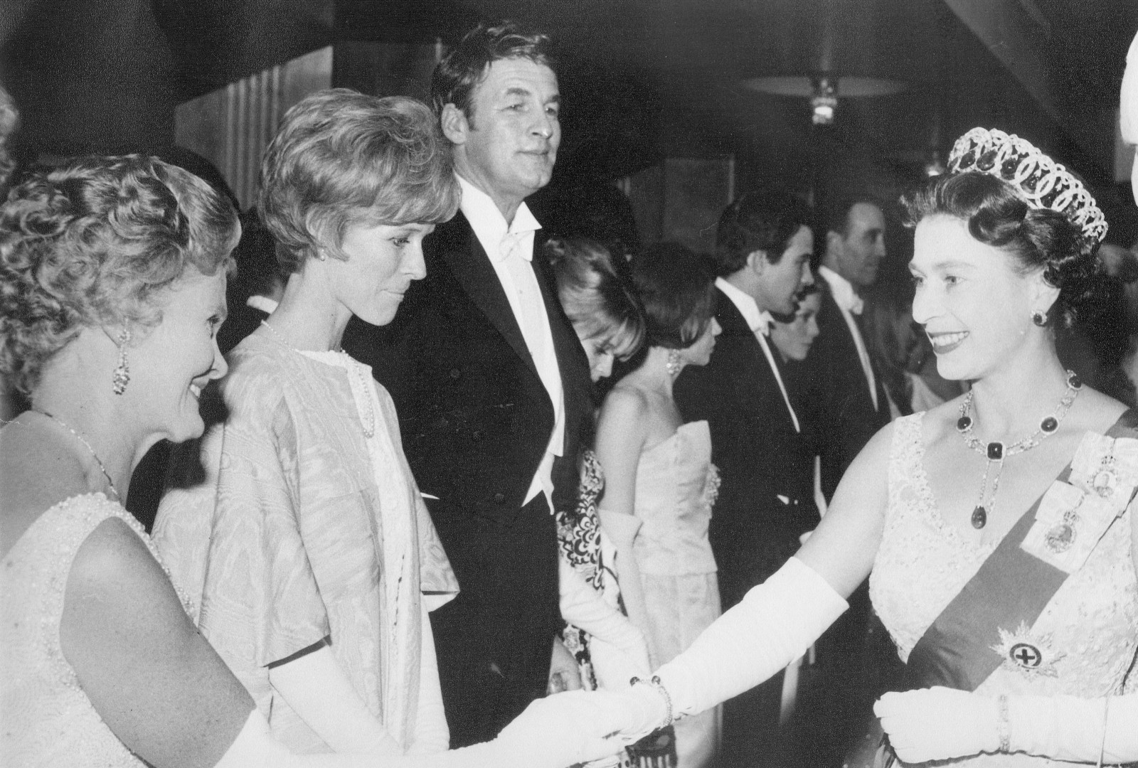 Joy Adamson, Virginia McKenna and Bill Travers line up to meet Her Majesty The Queen at the premiere of Born Free