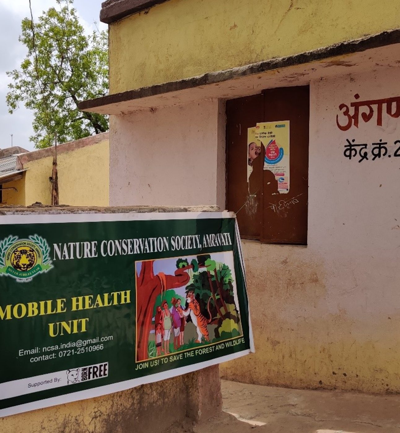A photo of a building with Mobile Health Unit signage