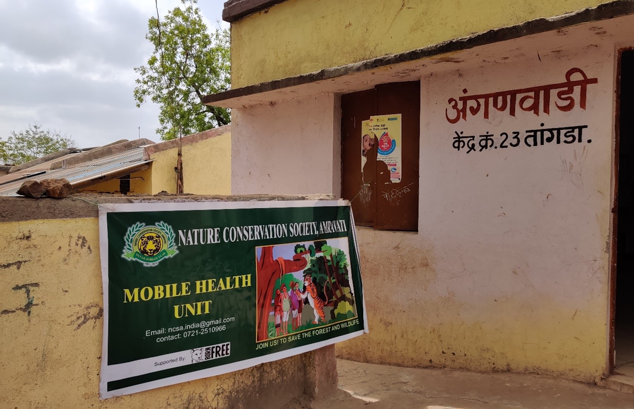 A photo of a building with Mobile Health Unit signage