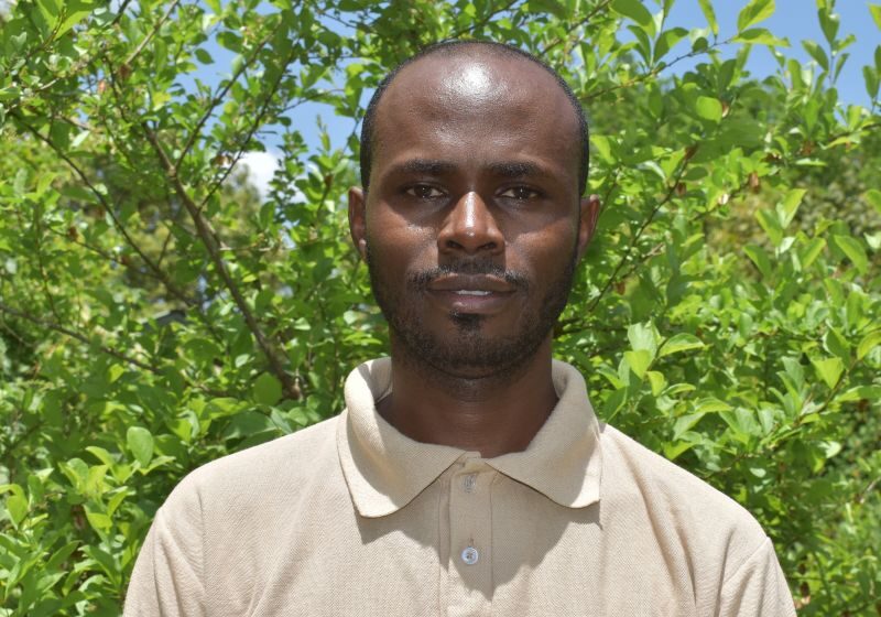 A headshot of Newton Simiyu