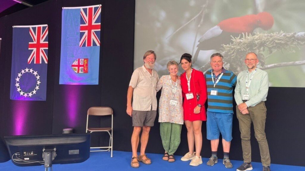 A group of people standing on stage at Birdfair 2025