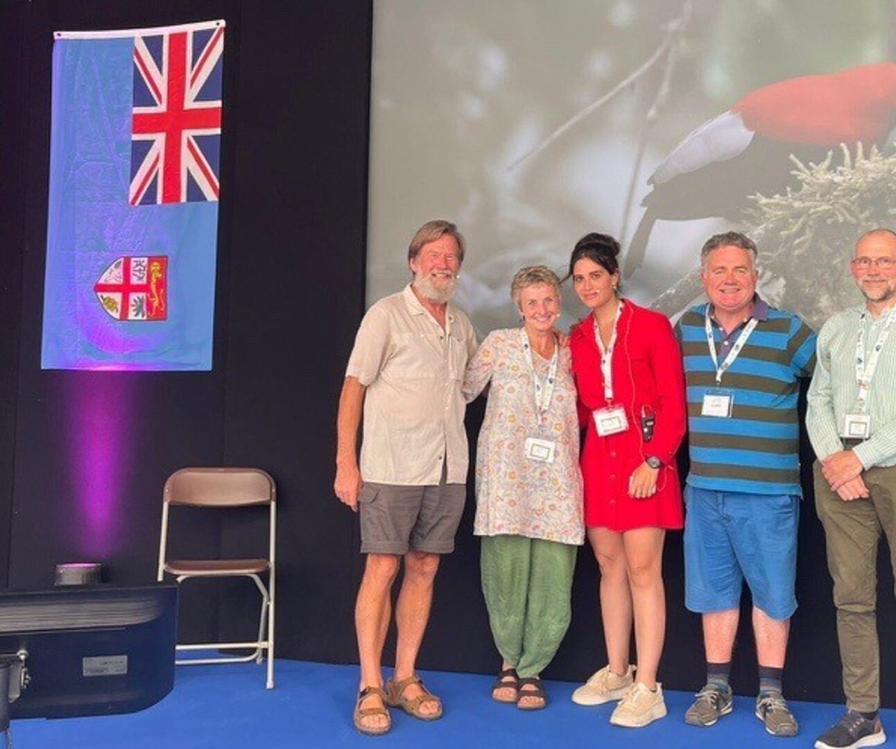A group of people standing on stage at Birdfair 2025