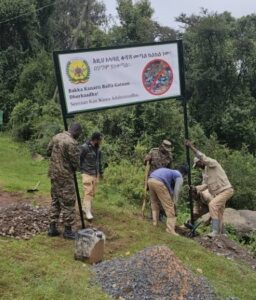 A group of people erecting a banner on a grass verge