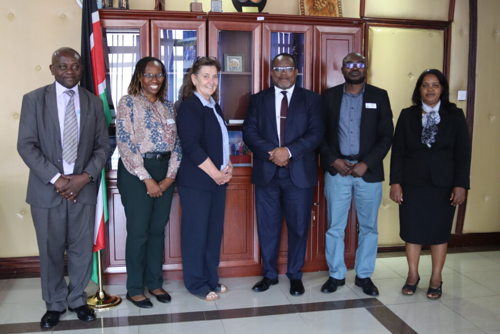 A group of people standing together at an official event