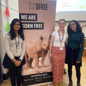 A group of sixth form students in front of a Born Free banner