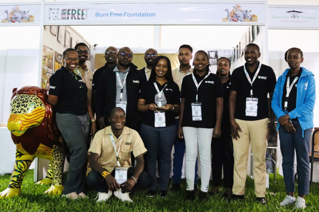 The Born Free Kenya team stood in front of an exhibition stand