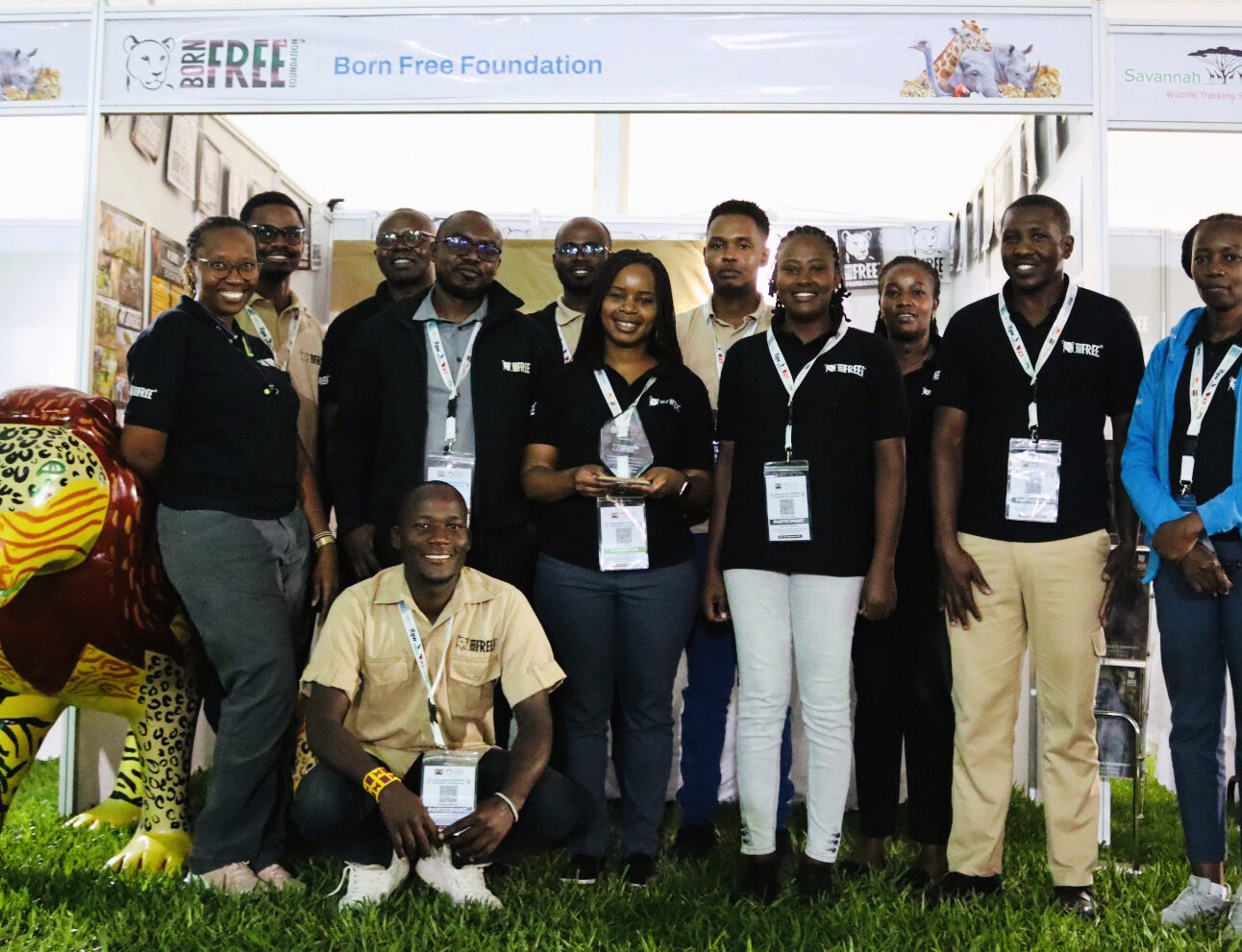 The Born Free Kenya team stood in front of an exhibition stand