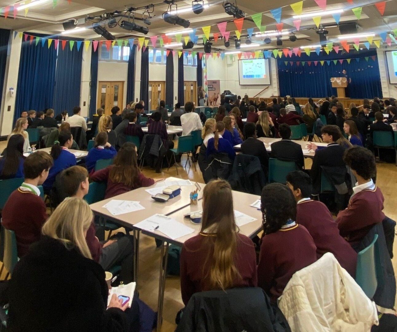 A group of students in a classroom workshop session